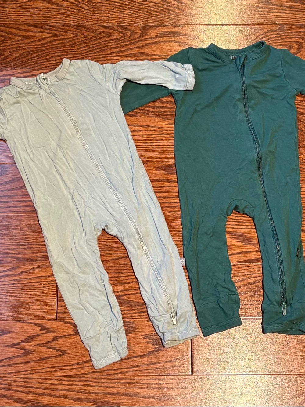 Kyte BABY Two-Pack Zippered One-Piece Footie Pajamas in Sage and Forest Green